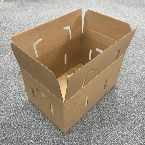 packaging of fruits and vegetables in cardboard crates
